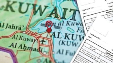 The image of a map of Kuwait with visa application forms overlaid.