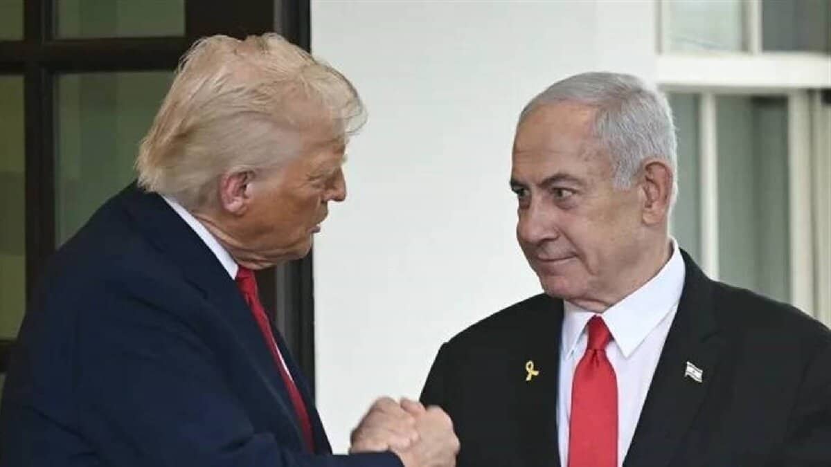 The image of Donald Trump on the left, wearing a dark suit with a red tie, shaking hands with Benjamin Netanyahu on the right, wearing a black suit with a red tie and a small flag pin, standing in front of a white building with large windows.