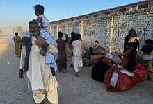Local residents, who fled their homes following border clashes between Pakistan and Afghan forces wait for transportation in Chaman a town on the Pakistan side of the Afghanistan border (PTI)