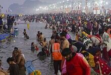 Devotees taking dip in Sangam on the occasion of 'Makar Sankranti' festival