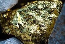 Gold nugget and grey granite stone