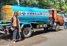 Image shows an HMWSSB tanker truck parked on the street
