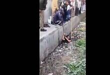 Municipal workers clean drain in UP