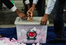 Bangladeshi polling officials open a ballot box for counting after the voting of national parliamentary election ended at a polling station in Bangladesh, on Thursday. AP/PTI