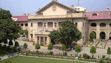 Historic court building in Allahabad with trees and gardens.
