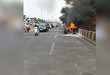 Image shows a bike in flames at the Durgam Cheruvu Cable Bridge