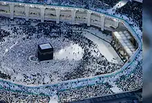 Aerial view of pilgrims performing Tawaf around the Kaaba at the Grand Mosque in Makkah during evening prayers.