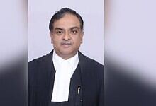 Indian judge in formal robes speaking about AI's role in legal training and judicial discipline.
