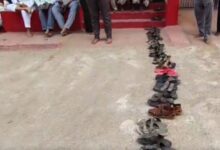 Queue of residents leaving footwear in line for LPG cylinders in Bhainsa.