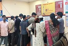 Crowd gathers at LPG booking counter amid rumours of shortage.