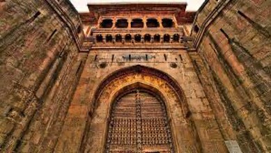 Ancient fort entrance at Mastani Mahal in Pune, showcasing Mughal architecture and rich history for visit.