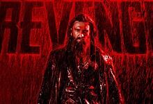 Intense scene from The Revenge featuring a man with long hair and beard in a rain-soaked setting.