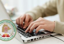 Image shows a person typing on a laptop keyboard alongside the official seal of the Telangana Public Service Commission (TGPSC).