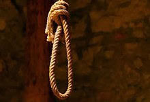 Image of a noose hanging from a wooden beam, symbolising suicide.