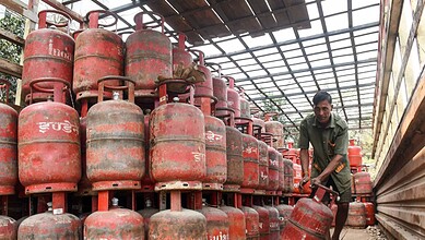 Large stock of LPG gas cylinders stored in a warehouse for distribution.