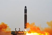 North Korean missile being launched into the sea amid rising tensions.