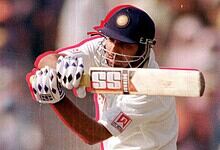 VVS Laxman batting during a cricket match, celebrating his 281 score milestone.