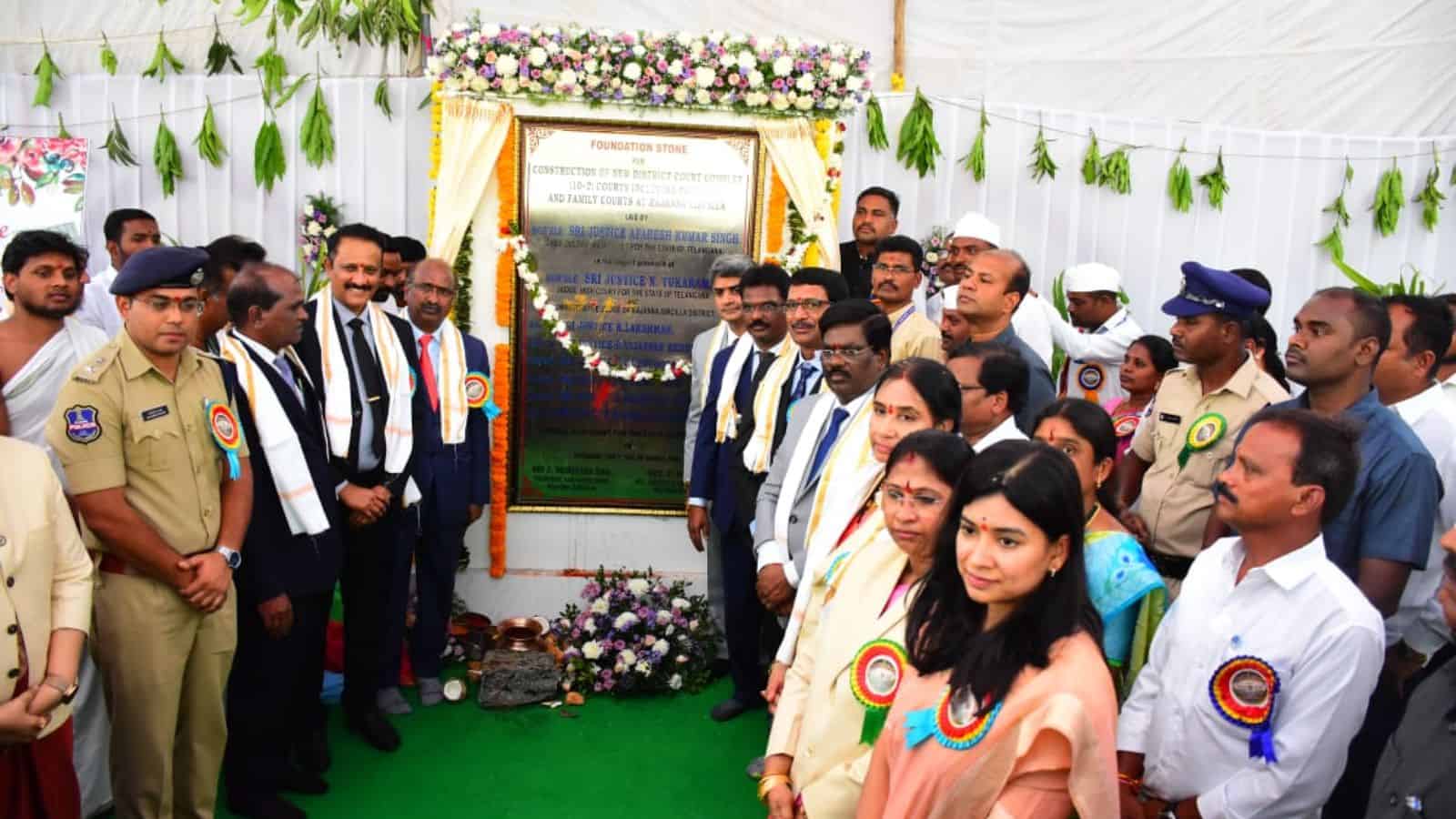 Group of officials and dignitaries at the foundation stone laying event for Sircilla court complex, Telan.