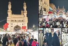 Crowd of shoppers at Hyderabad's Charminar market during Eid celebrations, bustling with vendors and fest.
