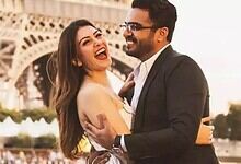 Happy couple Hansika Motwani and Sohael Khaturiya embracing in front of the Eiffel Tower in Paris.