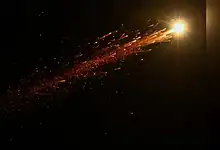 Bright missile trail in the night sky over Jerusalem during an Iranian missile launch towards Israel.