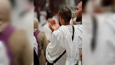 Pilgrim making dua at Masjid Al-Haram in Makkah during Ramzan night prayers.