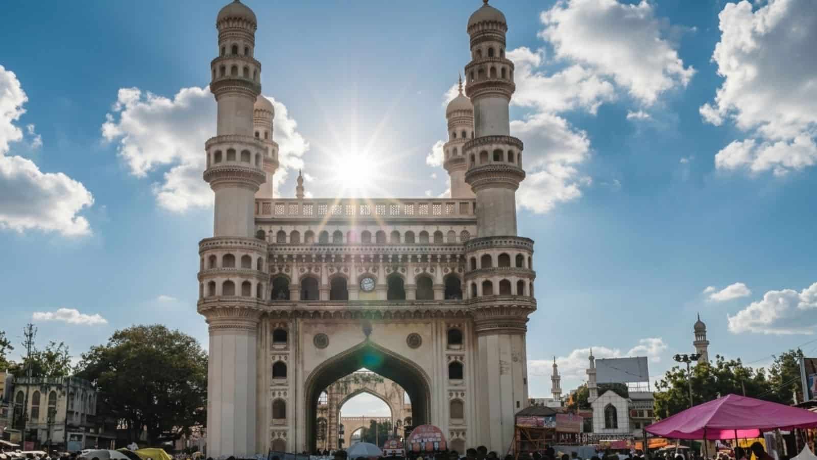Charminar in Hyderabad with clear sky and sunlight, showcasing the historic monument during summer.