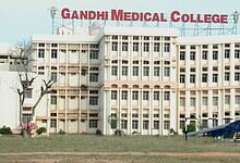 Gandhi Medical College exterior with signage, showing the campus infrastructure.