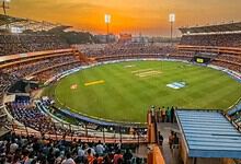 Cricket stadium filled with spectators at sunset, preparing for IPL 2026 matches.