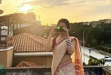 Pakistani actress taking a selfie outdoors, celebrating reaching 20 million followers on Instagram.