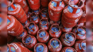 Stacked LPG gas cylinders for domestic use in India.