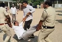 Ex-Sarpanch being forcibly removed during protest over Rs 22 lakh dues in Telangana.