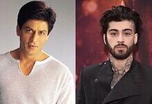 Shah Rukh Khan and Zayn Malik pose together at a public event, showcasing their style and charisma.