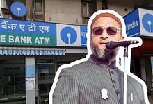 A man speaking into a microphone outside a State Bank ATM in India.