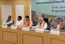 Panel of officials at the National Review of Swachh Bharat, Vigyan Bhawan, discussing sanitation initiati.