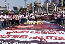 Protest march in Hyderabad demanding justice and rights, with participants holding banners and placards i.