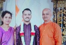 Celebrating a special event with three individuals dressed in traditional attire at a formal gathering.