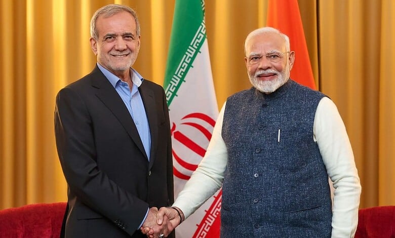Indian Prime Minister Narendra Modi and Iran President Ebrahim Raisi shake hands at a diplomatic event.