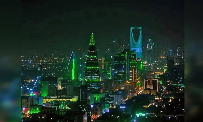 Riyadh skyline illuminated at night with prominent skyscrapers in Saudi Arabia.