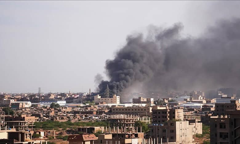 Thick black smoke rising from buildings after drone attacks in Sudan.