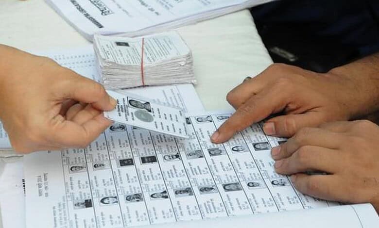 Voters' identification process during an election in India, with ballot papers and ID cards visible.