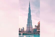 Iconic Burj Khalifa skyscraper towering over Dubai cityscape during daytime.