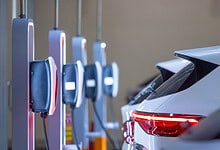 Electric vehicle charging station with multiple cars being charged in Telangana, India.
