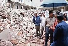 Officials inspect rubble after building collapse in Anjaiah Nagar, Hyderabad.