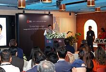 JLL Hyderabad launch event with speaker addressing audience at the inauguration.
