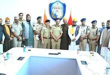 Hyderabad police officials and community leaders gather for a meeting during Milad-un-Nabi celebrations.