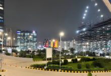Night view of Hyderabad city with modern buildings and illuminated streets.