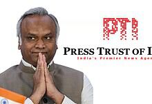 Kharge with folded hands, Press Trust of India logo in background, India news.