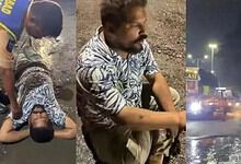 Man sits in a pothole in Hyderabad