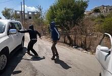 Masked Israeli settlers attack an NBC News crew and a Palestinian woman in Jalud, occupied West Bank.